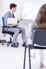 Business presentation in the office with man and woman