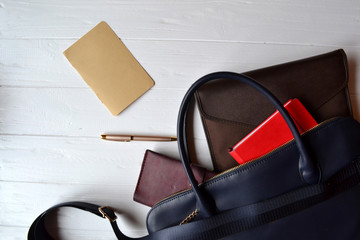 Business bag and empty paper on the desk. Business flat lay.