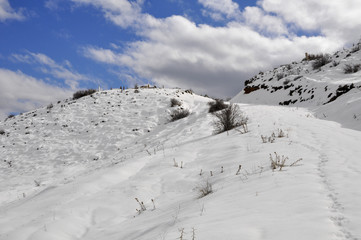 Fototapeta na wymiar Sivrialan in winter, graveyard on the hill