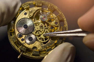 Watchmaker is repairing the mechanical watches in his workshop