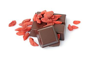 Close-up pieces of dark chocolate bar with dried Goji berries