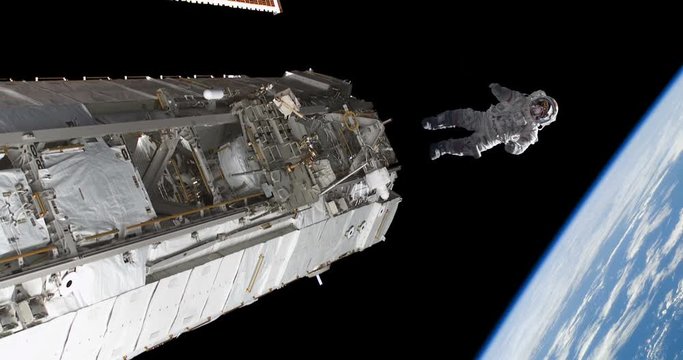 Astronaut Spacewalker Pushing off Space Station Floating Over Earth some elements furnished by NASA images