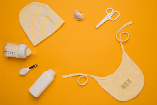 Baby, newborn child care hygiene accessories. Kid, infant health product on yellow  background.  concept of child care.