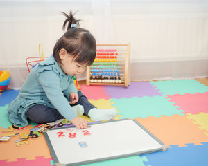 Baby girl learning math at home