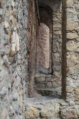 Isolated, close-up of a solid stone wall, with stone supports that create an arch shape see through, in Mexico - 192074576