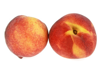 Two peaches isolated on a white background