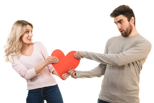 The couple holding a heart symbol on the white background