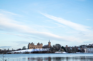 Linlithgow Palace and Loch in winter with snow; the birthplace of Mary, Queen of Scots; situated by Linlithgow Peel, West Lothian, Scotland.