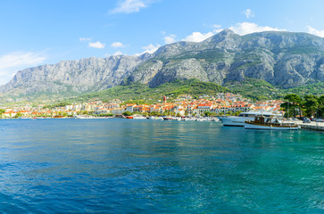 Fototapeta na wymiar beautiful view from Adriatic sea with yachts of town Makarska, Dalmatia, Croatia
