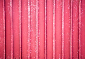 Texture background of red corrugated fence.