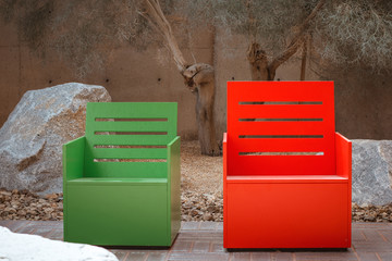 Bright wooden chairs on the background of a concrete wall in the loft style