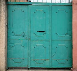 Old green metal door
