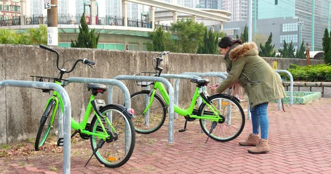 Tin shui Wai, Hong Kong, 5 February 2018:- Woman using share bike in the city