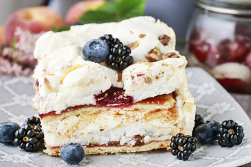 Layer fruit cake with meringue topping.