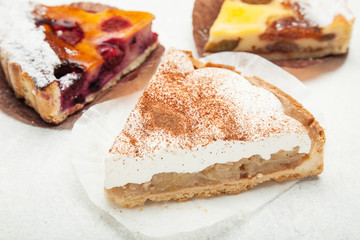 Portion of homemade pie on white background.