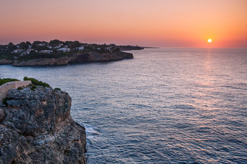 Sunrise at the Mediterranean Sea with the coast of the Spanish island of Mallorca, Europe.