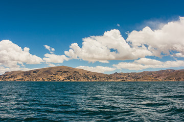 View of Puno mountains from the Titicaca lake, Peru