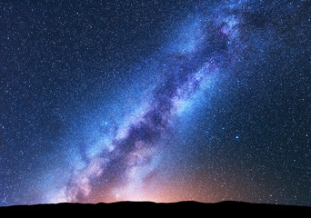 Milky Way. Fantastic night landscape with bright milky way, sky full of stars, yellow light and...