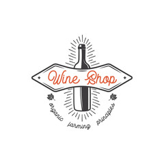 Wine shop logo template concept. Wine bottle, leaf, sunbursts and typography design. Stock vector monochrome emblem for winery, wine shop logotype, store isolated on white background
