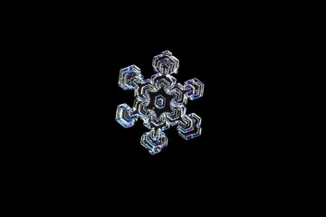 Symmetric Snowflake on a Black Background