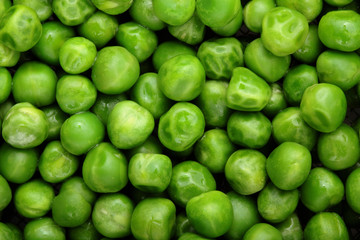 Fresh green peas background texture top view.Full depth focus.