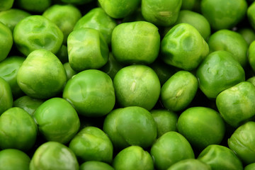 Fresh green peas background texture top view.Full depth focus.