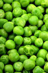 Fresh green peas background texture top view.Full depth focus.