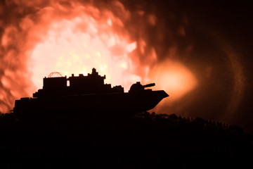 Silhouette of military war ship on dark foggy toned sky background. Selective focus
