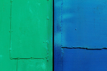 Green and blue colored metal background