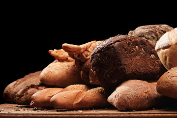 Fragrant bread on the table. Food concept on black