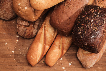 Fragrant bread on the table. Food concept on wooden cutting board