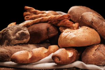 Fragrant bread in textile bag or table cloth