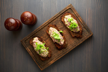 bruschetta, on slices of toasted baguette garnished with basil