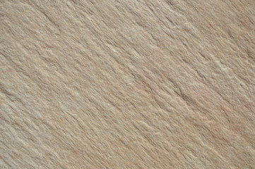 Closeup on ceramic tile detailed surface rough marbled textured background
