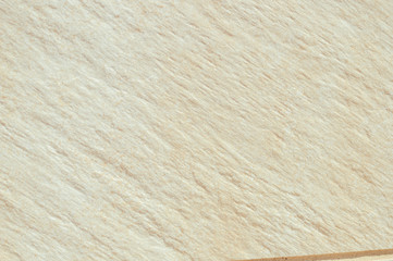 Closeup on ceramic tile detailed surface rough marbled textured background