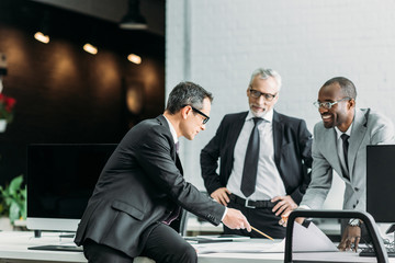 Businessmen discussing in office