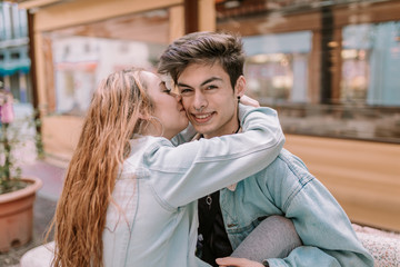 Couple in love having a good time. Couple having fun. Young lovers enjoying a sunny day.