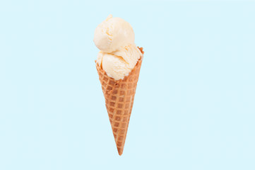 Vanilla ice cream cone on white background.