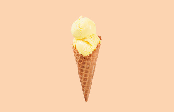 Vanilla ice cream cone on white background.