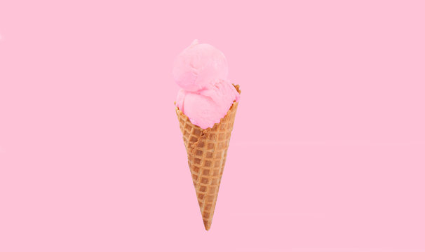 Strawberry ice cream cone on white background.