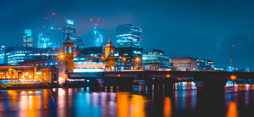 Fototapeta na wymiar panorama of modern london cityscape in the night with Southwark Bridge in the foreground