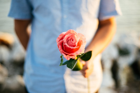 Man giving a rose