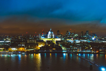 beautiful cityscape overview of london in the night with st pauls church in the middle