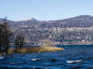 Fototapeta na wymiar landscape of Lake Maggiore with strong wind and waves