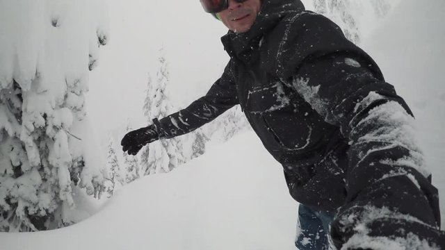 Han Holding Selfie Stick Snowboarding Backcountry Powder