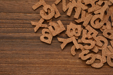 Alphabet on a wooden background 


