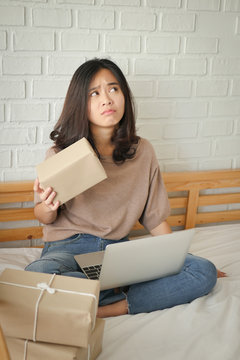 worried frustrated upset unhappy woman online ecelctronic commerce vendor thinking with computer at home office, working problem concept