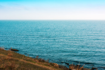 Fototapeta na wymiar Sea coast with azure water