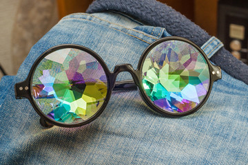designer glasses with kaleidoscope glasses on jeans