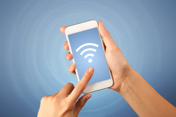 Female hand holding smartphone